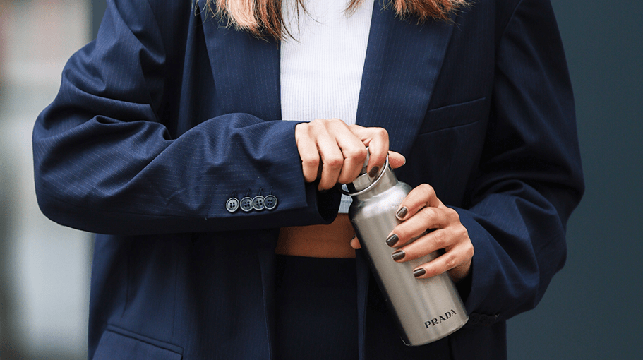 woman carrying a designer water bottle