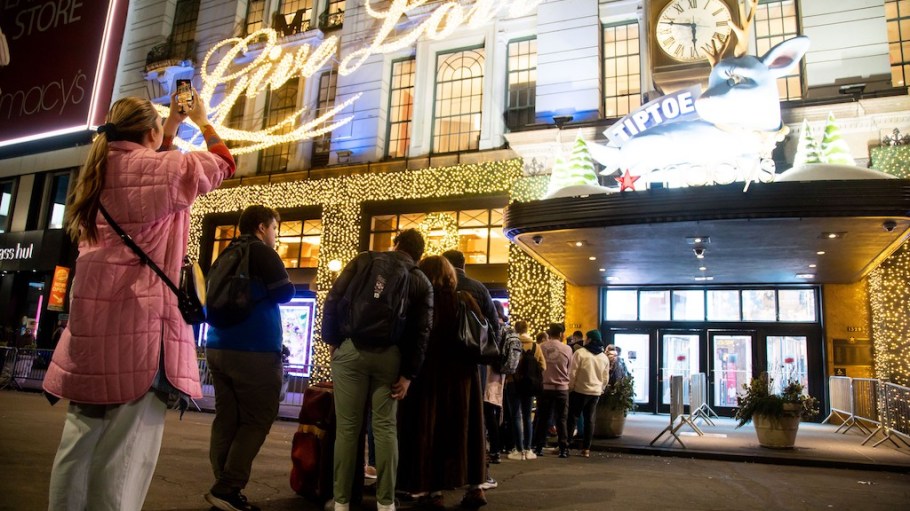 People wait for the opening of a Macy's store during Black Friday in New York, the United States, Nov. 25, 2022. (Photo by Michael Nagle/Xinhua via Getty Images)