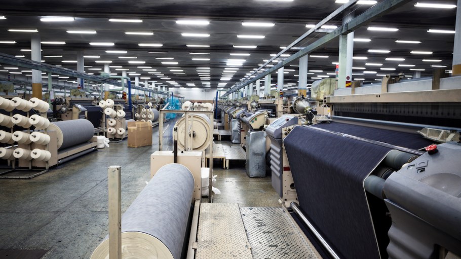 Weaving fabric on air jet looms.