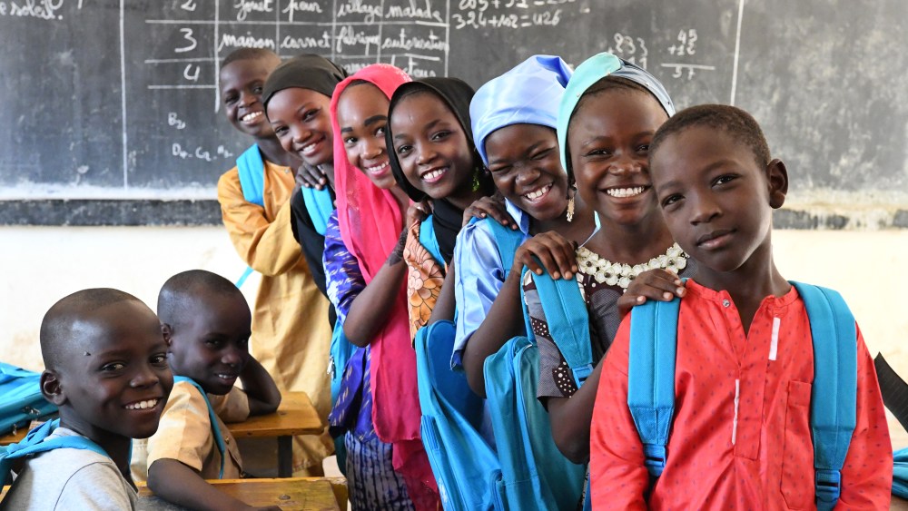 Children attending class in the Noma school, in Maradi, in the South of Niger. The students are excited because they received new school kits. UNICEF provided school materials and training for teachers and parents for their participation in the management of the school. For every child, education.