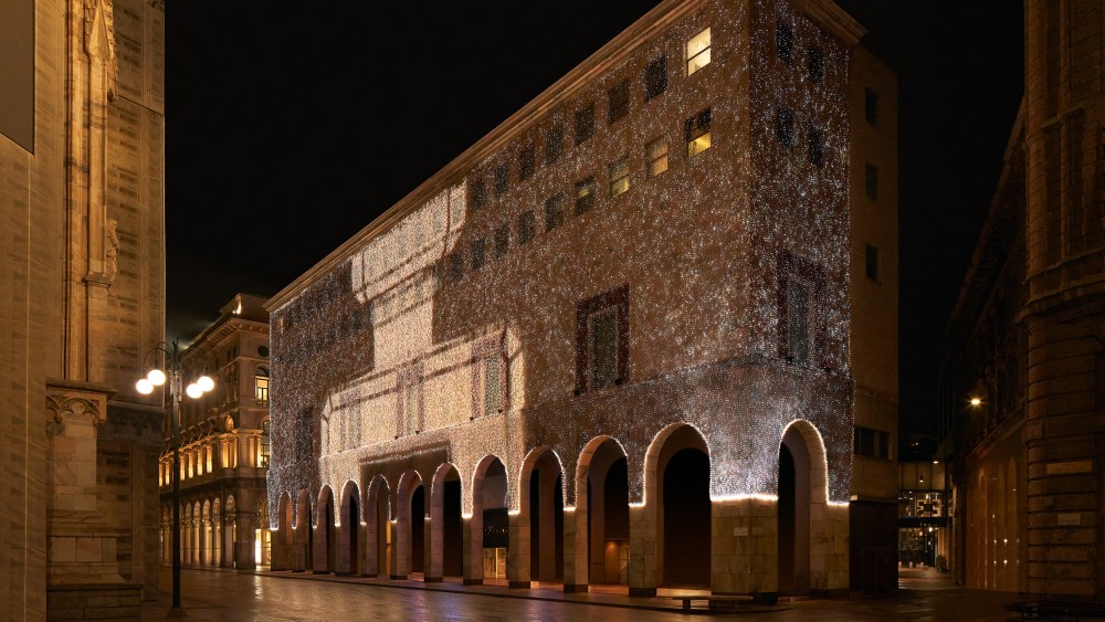 The facade of Milan's Rinascente with Chanel lighting as part of the takeover activation.