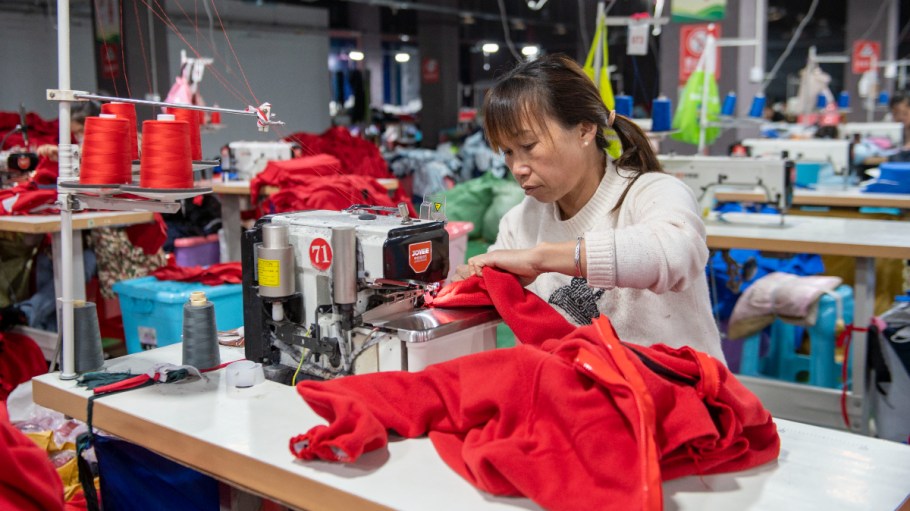 QIANDONGNAN, CHINA - NOVEMBER 14, 2023 - Workers produce garments at a workshop of a garment company in Qiandongnan, Guizhou Province, China, Nov. 14, 2023.