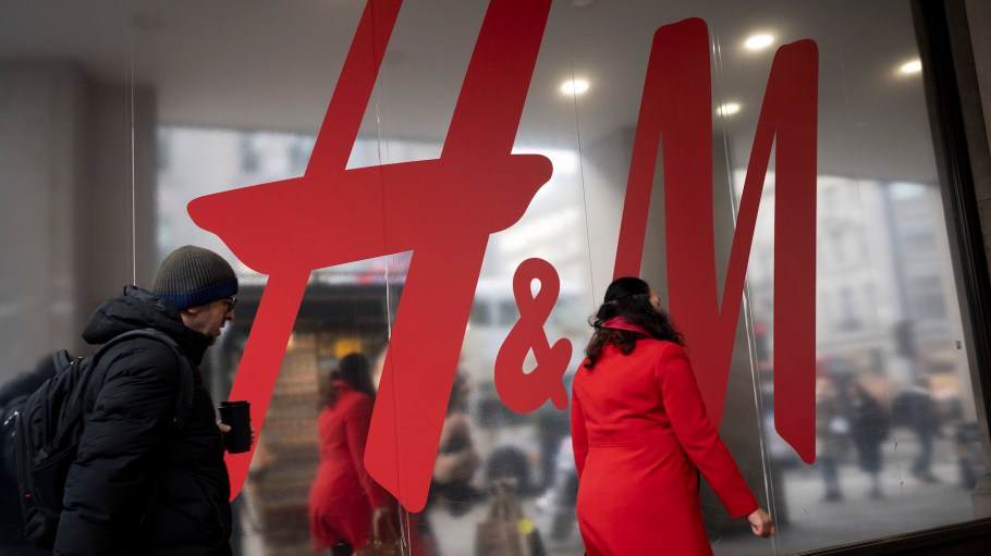 Christmas shoppers walk past H&M at Oxford Circus on 20th December 2023, in London, England.