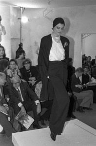 Satin shirtcoat with wide-leg pants and blouse in Donna Karan's RTW Spring 1986 show.
