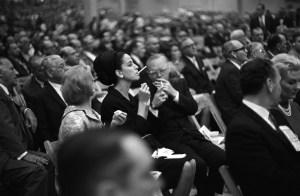 Truman Capote and Gloria Guinness attend the Sonny Liston vs Muhammad Ali boxing match, Miami Beach on February 25, 1964.