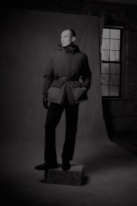 Nobis premium stretch ripstop coat filled with white Canadian duck down; John Varvatos wool, cotton and recycled polyester pants; Barbour belt and gloves; Geox boots.