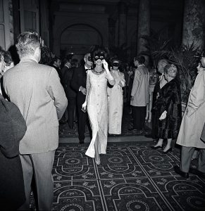 A masked Gloria Guiness arriving at Truman Capote's Black and White Ball in the Grand Ballroom at the Plaza Hotel in New York City