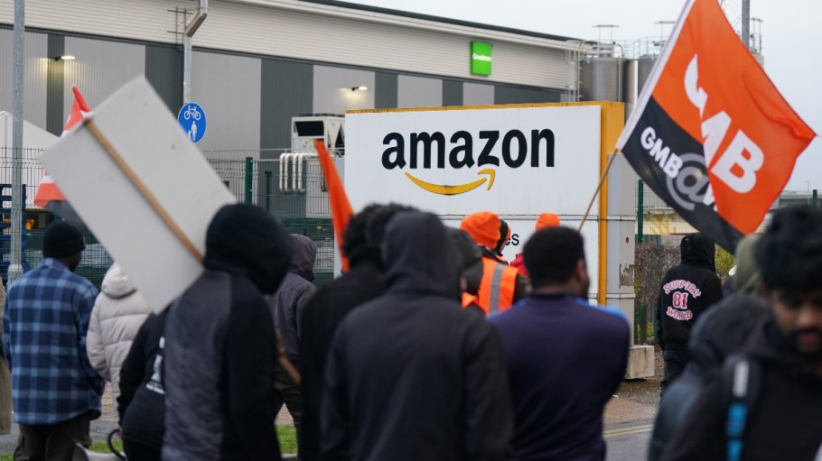Amazon employees stand on a GMB union picket line outside the e-commerce giant's site in Coventry, England, in November 2023.