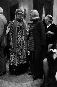Socialite Gloria Vanderbilt and guest attend Adolfo Sardini's summer 1970 ready to wear collection debut at the St. Regis Hotel.