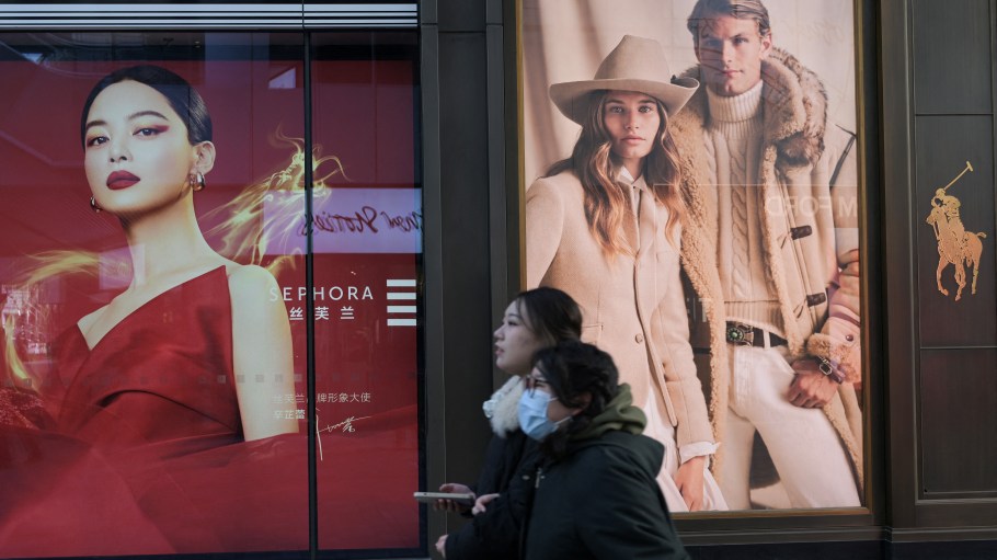 People walk at a shopping mall in Beijing on January 16, 2024.