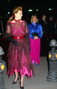 LONDON, UNITED KINGDOM - OCTOBER 08:  Sarah, Duchess Of York, Arriving For The Charity Film Premiere Of "beverley Hills Cop II" At The Empire Cinema In Leicester Square.  The Duchess Is Wearing A Pink And Black Silk Tulle And Chiffon Dress With A Beaded Handkerchief Hem Designed By Fashion Designer Zandra Rhodes.  (Photo by Tim Graham Photo Library via Getty Images)