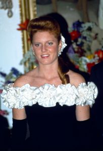 MAURITIUS - SEPTEMBER 27:  Sarah, Duchess Of York, Attending An Official Banquet At The Governor-general's Residence Le Reduit During Her Visit To The Tropical Island Of Mauritius.  The Duchess Is Wearing A Black Gown With Cream Satin Roses Designed By The Fashion Designers Emanuels Reported As Her "guinness Dress".  (Photo by Tim Graham Photo Library via Getty Images)