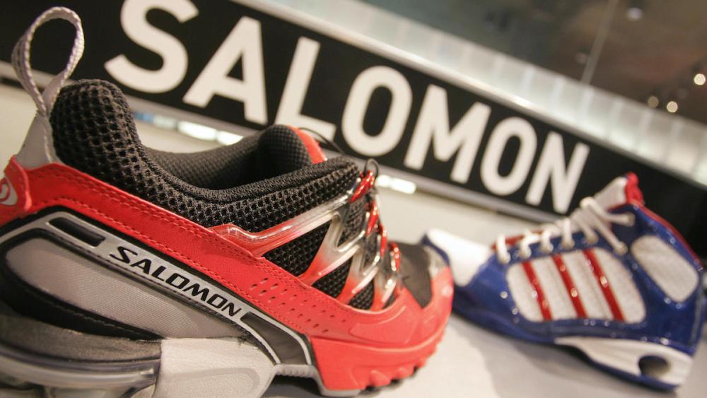 HERZOGENAURACH, Germany: Sport shoes of the brands Adidas (R) and Salomon are seen in a shop 03 May 2005 in Herzogenaurach, southern Germany. Adidas-Salomon, the German maker of sportswear and equipment, annuonced on 02 May 2005 that it had agreed to sell its French subsidiary Salomon to Finnish firm Amer Sports Corporation in a deal that valued Salomon at around 485 million euros (621 million dollars). AFP PHOTO DDP/OLIVER LANG GERMANY OUT Ein Sportschuh der Marke Salomon steht am Dienstag (03.05.05) in Herzogenaurach vor einem Schuh von adidas. Am Mittwoch (03.05.05) hat der Sportartikelhersteller seine Hauptversammlung. Foto: Oliver Lang/ddp (Photo credit should read OLIVER LANG/DDP/AFP via Getty Images)