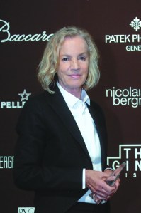 Fashion designer Jil Sander at an awards event in a white shirt and black fitted jacket