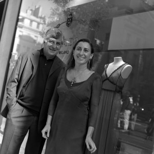 Designer Miuccia Prada and executive Patrizio Bertelli pose for photographs in front of the newly opened Prada flagship store on Madison Avenue and 70th Street in New York City.