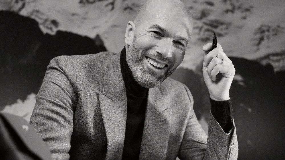 Zinedine Zidane pulls up a seat at Montblanc's new desk, desgined by Marco Tomasetta.