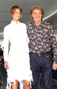 LONDON - SEPTEMBER 22: Designer Paul Smith stands with a model on the catwalk at the "Paul Smith Woman" show during London Fashion Week held at the Empress State SW6 on September 22, 2003 in London. (Photo by Steve Finn/Getty Images)