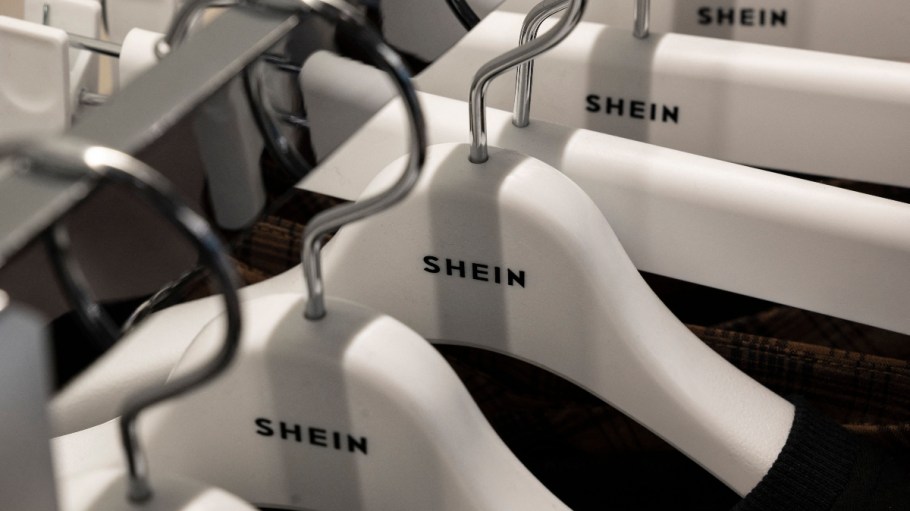 Shein hangers lined up on rack.