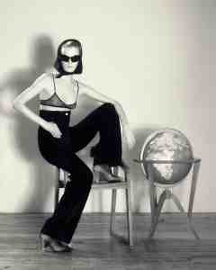 Loewe velvet pants; Celine bra; Louis Vuitton shoes; Calzedonia tights; Givenchy Giv Cut sunglasses.