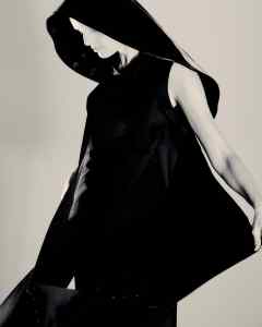 Maison Margiela silk cape dress; Roger Vivier Viv’ Choc Fisherhat in black patent leather.