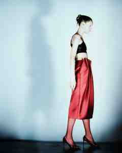 Avellano latex top; Simone Rocha satin skirt; Christian Louboutin shoes.