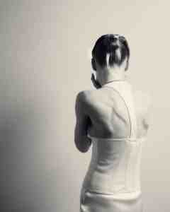 Saint Laurent duchess stretch silk dress; Sportmax belt; Graff white, round, pear and oval diamond necklace.