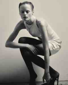 Saint Laurent duchess stretch silk dress; Sportmax belt; Graff white, round, pear and oval diamond necklace.