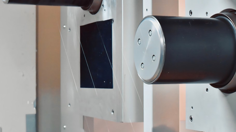 Filament passing over a godet roll in the Fiber Spinning Lab at The Nonwovens Institute, NC State University.