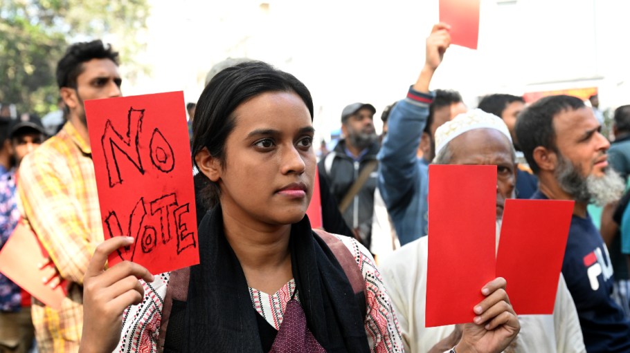 Activists from the Leftist Party's Alliance 'Ganatantra Mancha' are holding red cards as they participate in a rally to protest against the upcoming 2024 general elections in Dhaka, Bangladesh, on December 30, 2023.
