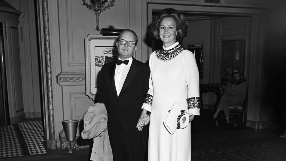 Washington Post publisher Katherine Graham and writer Truman Capote arriving at Truman Capote's Black and White Ball in the Grand Ballroom at the Plaza Hotel in New York City (Photo by Fairchild Archive/Penske Media via Getty Images)