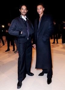 Guillaume Diop (R) and guest at Balmain Men’s Fall 2024 as part of Paris Men's Fashion Week held at Grande Halle de la Villette on January 20, 2024 in Paris, France.