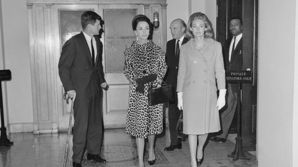 Published; Cropped for publication;  Socailite Gloria Guinness walking in a patterned silk dress with Ted and Joan Kennedy in Washington D.C...Article title: "Mrs Guinness Goes to Washington"