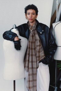 A lambskin Hustler jacket, cotton plaid blouse, Badboy jeans and custom earrings created with Chrishabana.
