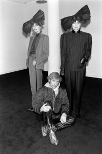 Designer Claude Montana poses with models