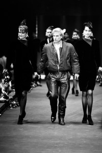 Designer Claude Montana takes a bow onstage during the Fall 1986 show.