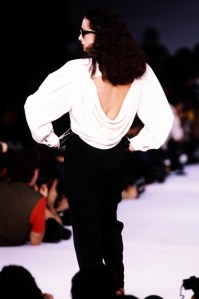 A model walks in the Claude Montana Spring 1986 Ready to Wear Runway Show on October 19, 1985, in Paris, France.
