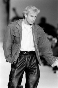 Designer Claude Montana takes a bow onstage of his spring 1986 show