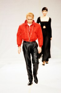 Designer Claude Montana walks the runway at the finale of the Claude Montana Spring 1998 Ready to Wear Runway Show on October 16, 1997, in Paris, France.