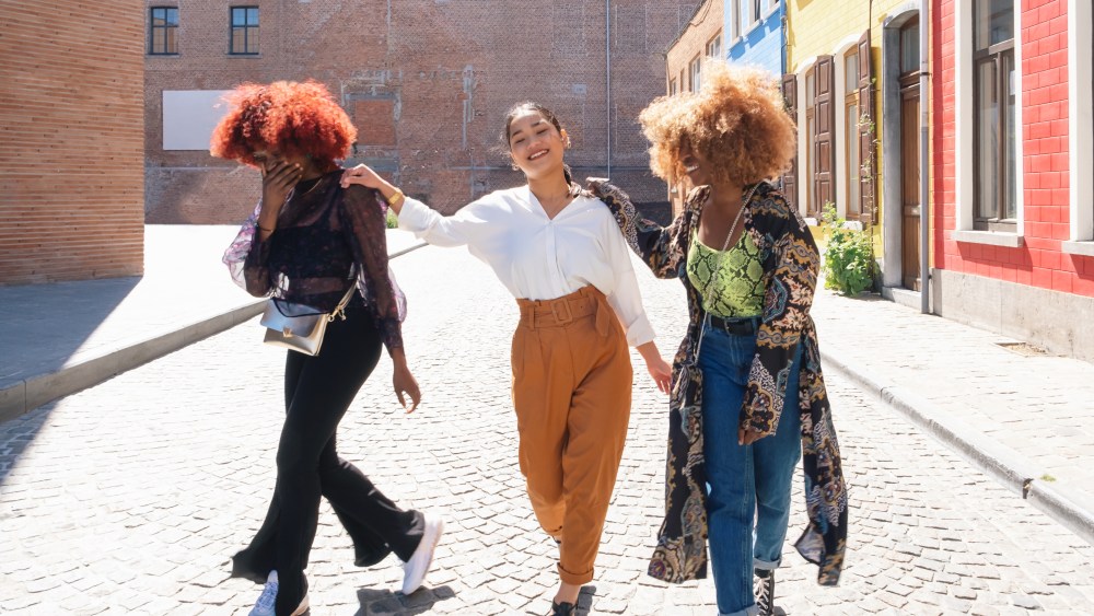 multiethnic happy friends young women laugh together. Female people smile and joy of friendship. urban youth gen z concept.
