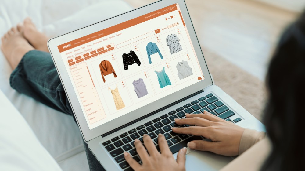 Woman shopping online on internet marketplace browsing for sale items for modern lifestyle and use credit card for online payment from wallet protected by crucial cyber security software