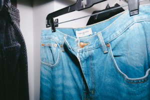 A look at girl in red getting ready for Tory Burch Fall 2024 show.