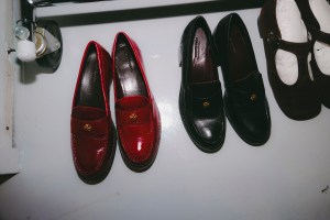 A look at girl in red getting ready for Tory Burch Fall 2024 show.