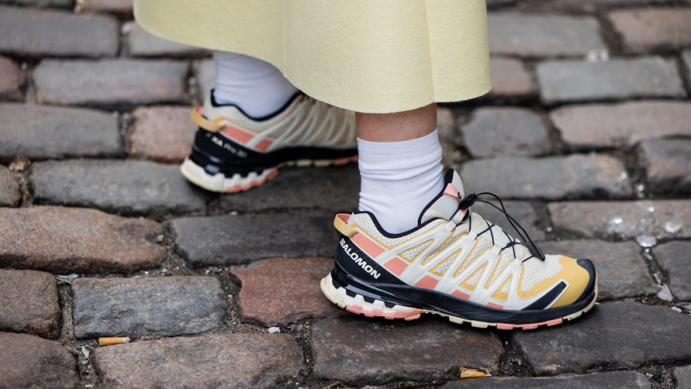 COPENHAGEN, DENMARK - JANUARY 29: A guest wears Salomon sneakers outside Nicklas Skovgaard during the Copenhagen Fashion Week AW24 on January 29, 2024 in Copenhagen, Denmark. (Photo by Christian Vierig/Getty Images)