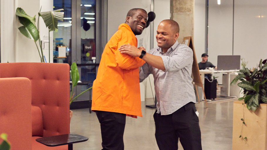 Derek Smith, managing director of Plug In Ventures (right), shakes hands with Ibert Schultz, LA stakeholder and executive director, Black College Success.