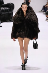 A model wears a jacket made of Icelandic shearling with bare legs at the Acne Studios Fall 2024 Ready-to-Wear Collection at Paris Fashion Week