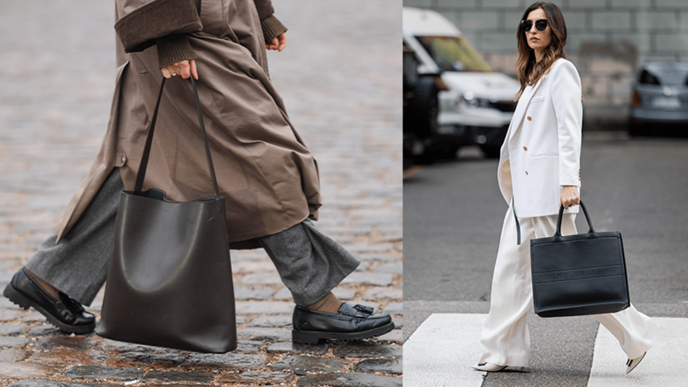 Close-up detail view of a brown leather bag and black leather loafers shoes, gray flared pants; women in white outfit crossing the street carrying a black leather tote