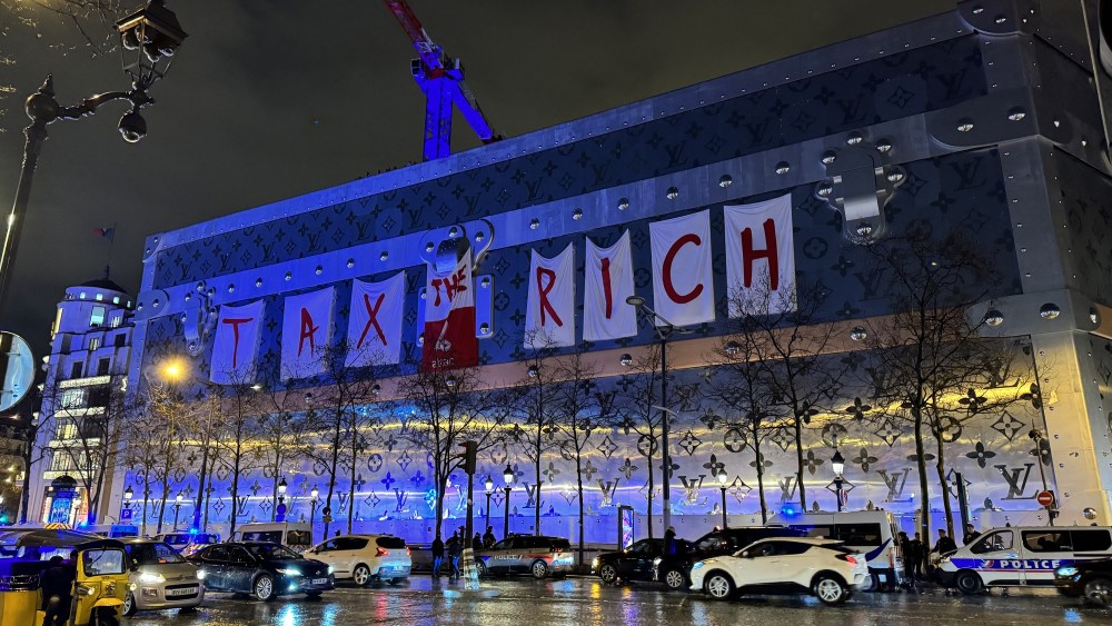 The Louis Vuitton hoarding on the Champs-Elysées in Paris was the target of activists on Saturday.