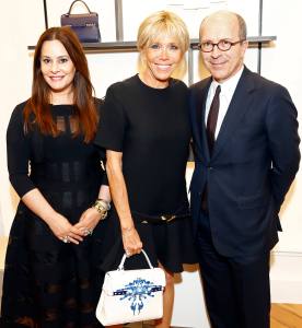 Delvaux President, Jean Marc Loubier, his wife, Hedieh Loubier and French First Lady Brigitte Macron are pictured during the visit of the partners of the heads of state and Government at Delvaux 'Le 27' on May 25, 2017 in Brussels, Belgium.