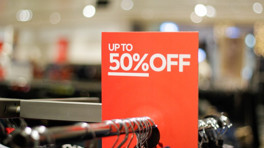 Sale sign on an in-store apparel rack.