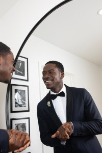 Damson Idris getting ready in Tommy Hilfiger for the 2024 NAACP Awards